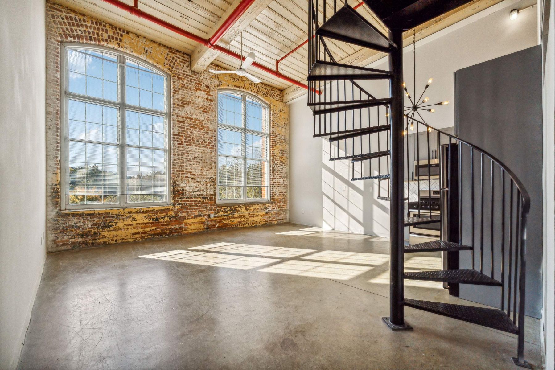 Luxury apartment kitchen with stainless steel appliances, granite countertops, and lots of storage space